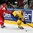 MINSK, BELARUS - MAY 22: Sweden's Dick Axelsson #28 attempts to play the puck while Yevgeni Kovyrshin #88 of Belarus defends during quarterfinal round action at the 2014 IIHF Ice Hockey World Championship. (Photo by Andre Ringuette/HHOF-IIHF Images)